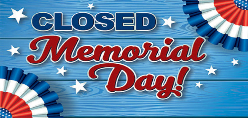 Memorial Day closed sign with blue, red, and white colors on a wooden background.